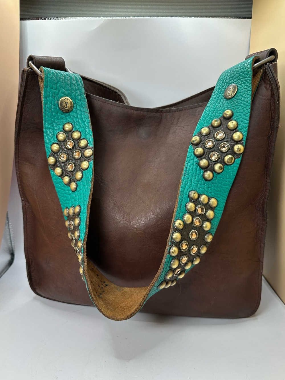 Two Bar West Brown Leather Shoulder Bag with Turquoise Studded Strap.